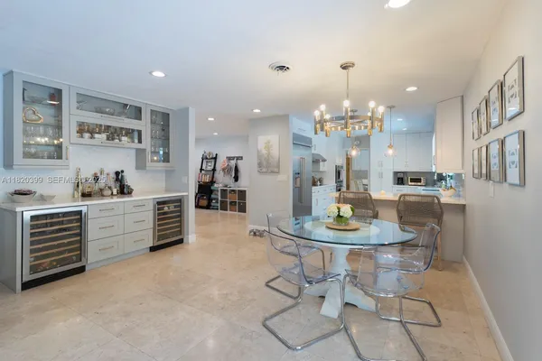a view of kitchen with dining table and chairs