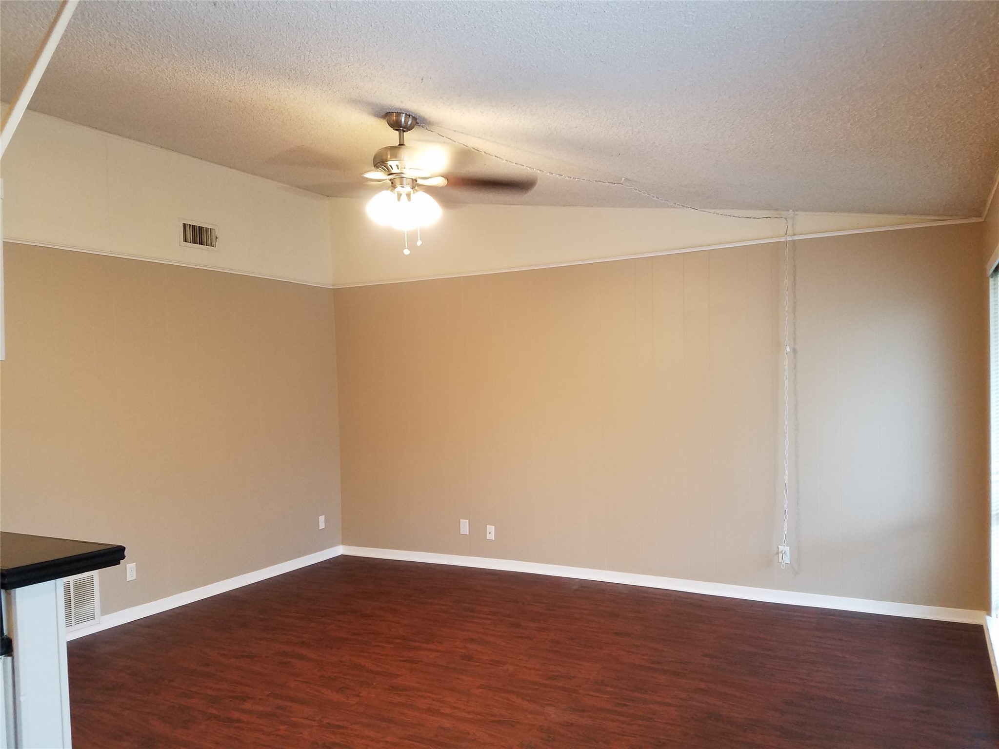 606 West 51st Street, Unit 104 Austin, TX 78751 - Photo 14 of 21 Spare room with dark wood finished floors and ceiling fan