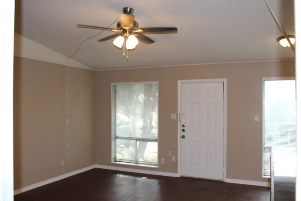 a view of an empty room with a window