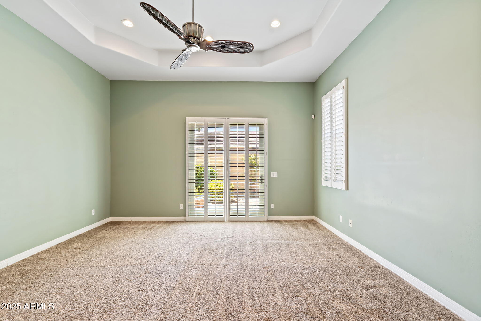 1535 West Winter Drive Phoenix, AZ 85021 - Photo 24 of 41 an empty room with windows and fan