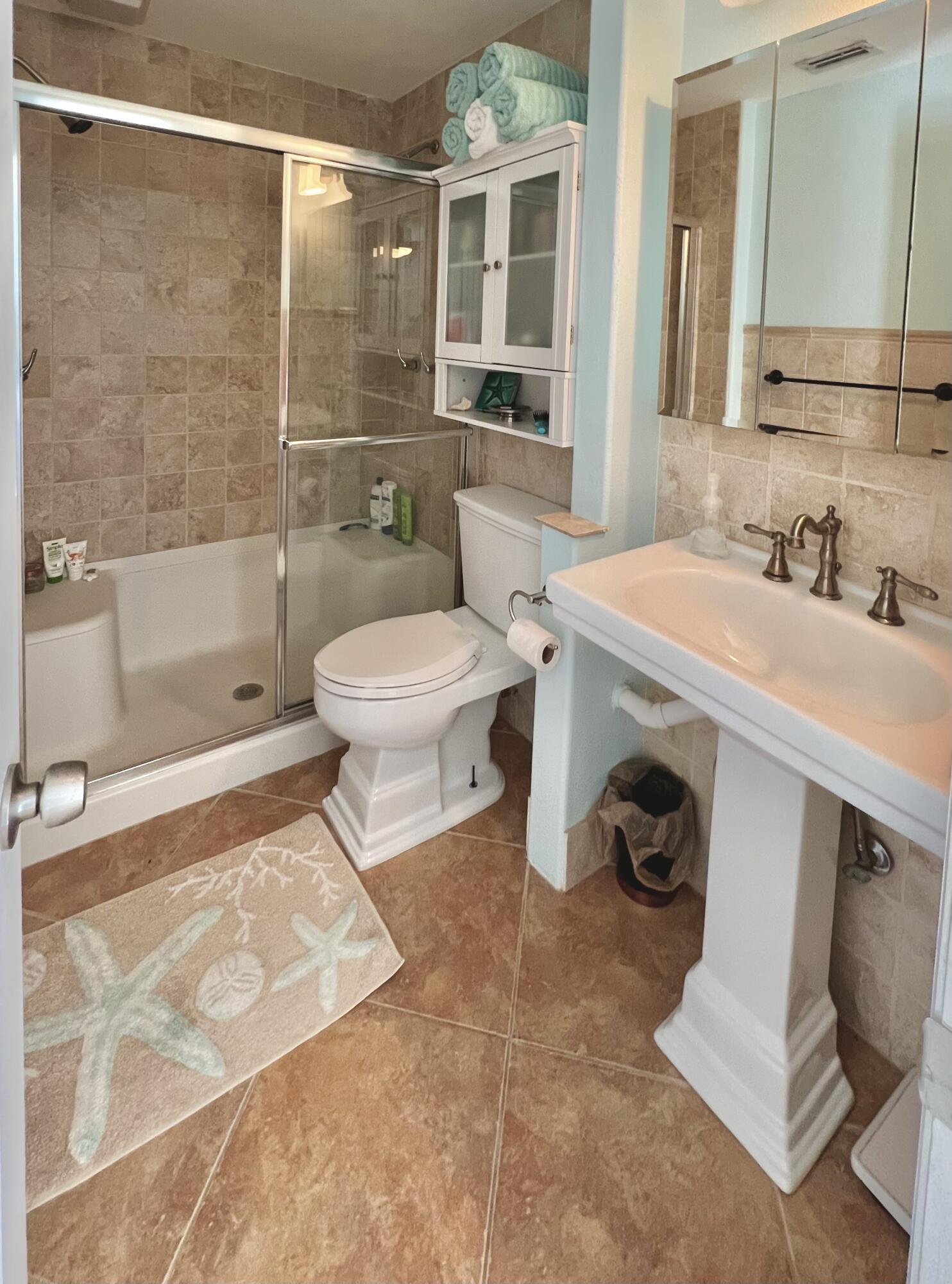 24 Bounty Lane Key Largo, FL 33037 - Photo 17 of 36 a bathroom with a sink a toilet and shower