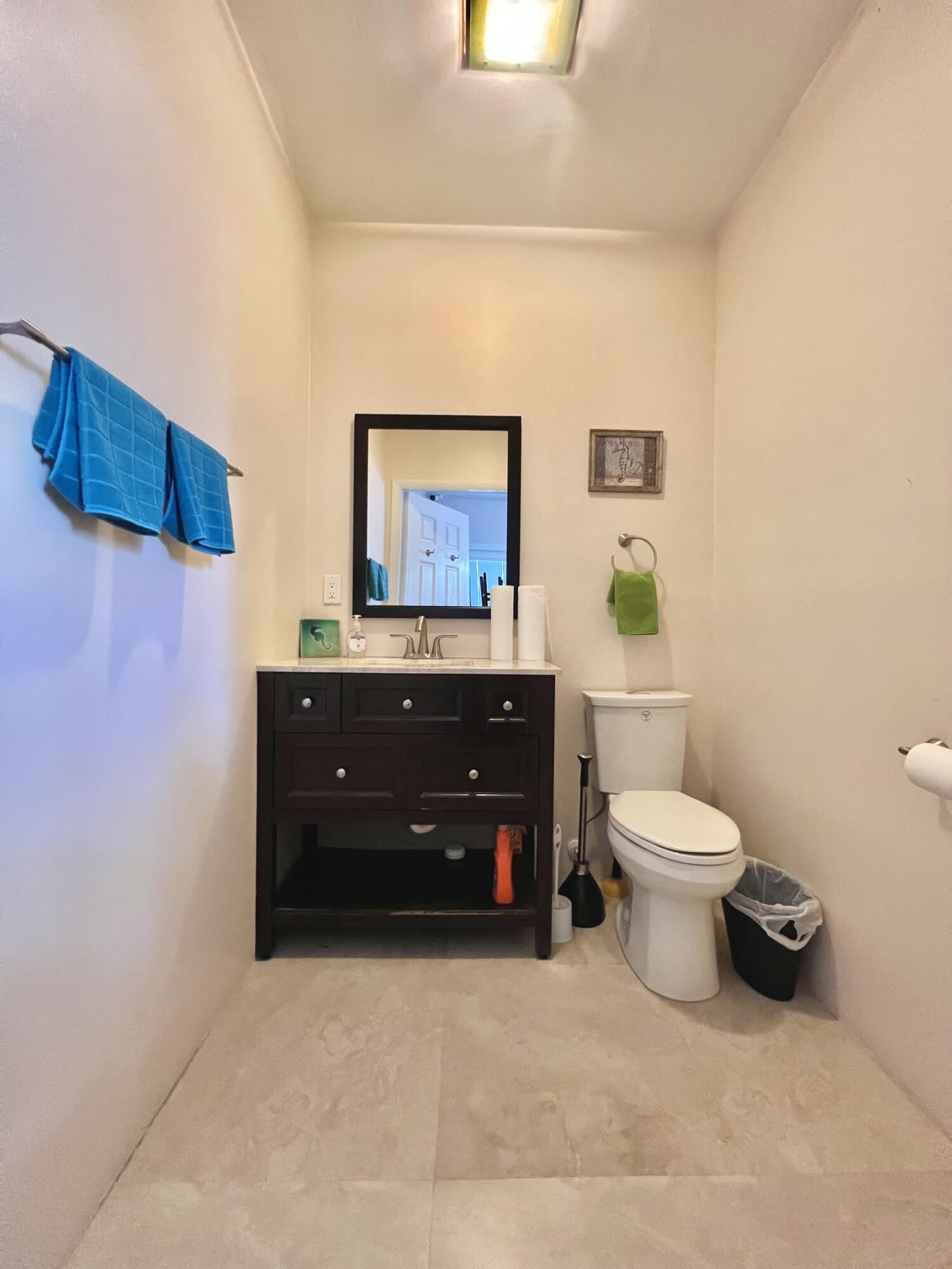 24 Bounty Lane Key Largo, FL 33037 - Photo 20 of 36 a room with a toilet and a sink