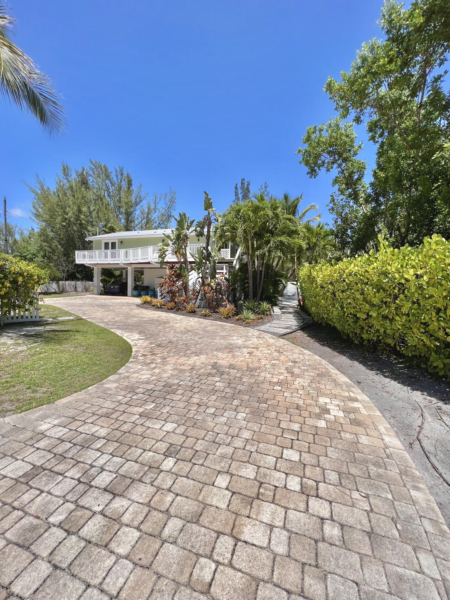 24 Bounty Lane Key Largo, FL 33037 - Photo 21 of 36 a view of a chairs and table on the terrace