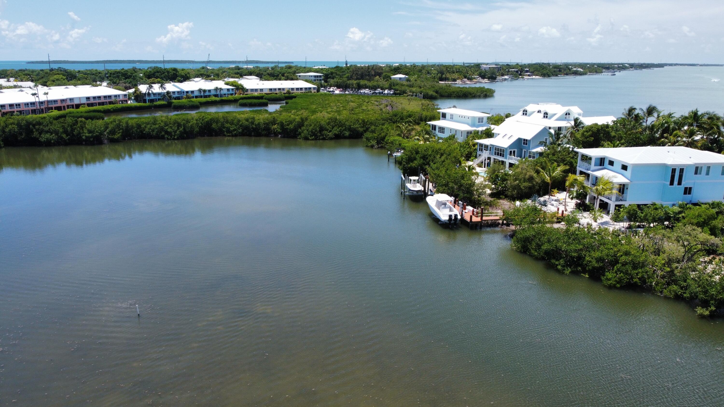 24 Bounty Lane Key Largo, FL 33037 - Photo 28 of 36 an aerial view of a city and lake view
