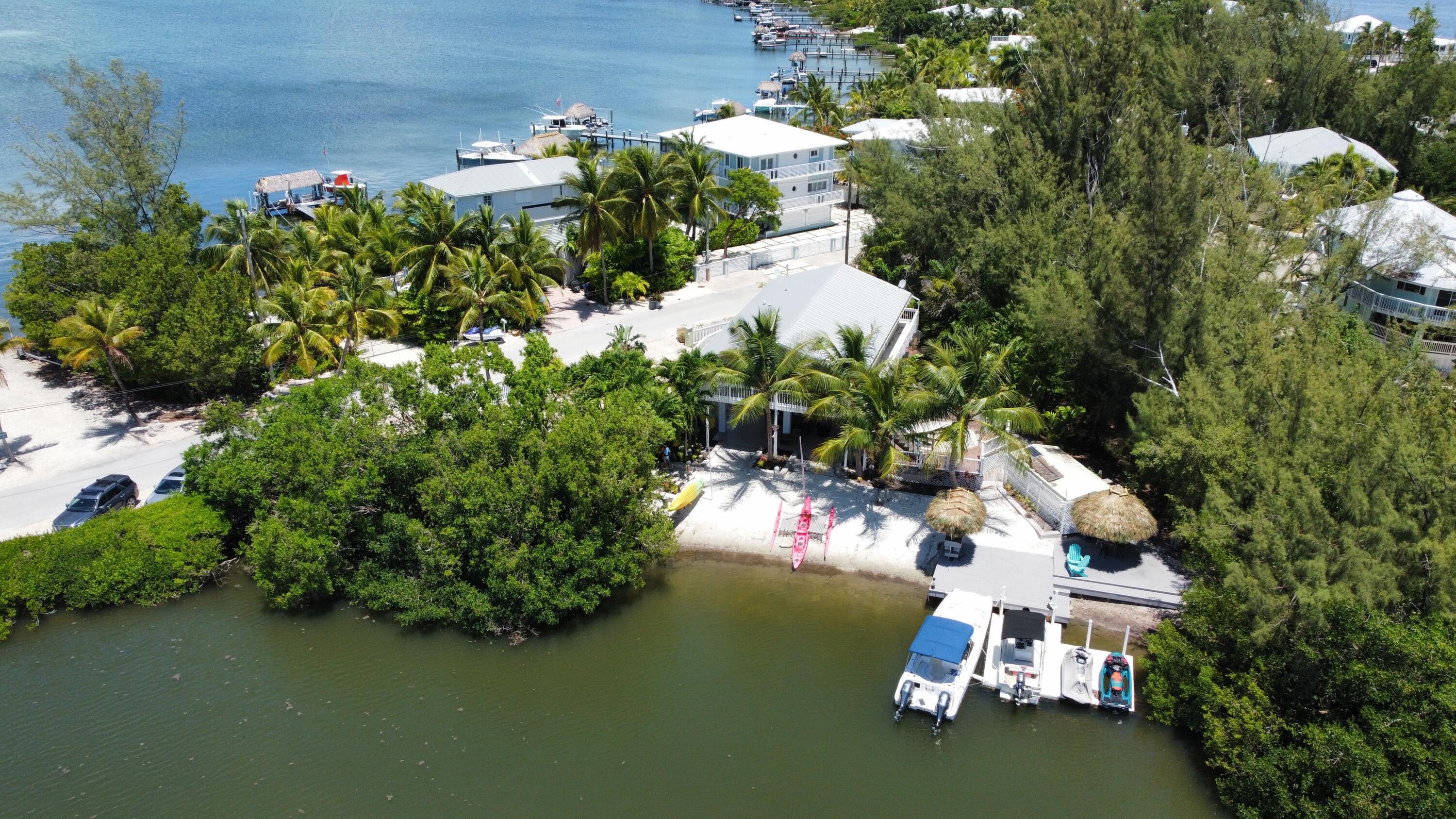 24 Bounty Lane Key Largo, FL 33037 - Photo 3 of 36 an aerial view of a house with a yard basket ball court and outdoor seating