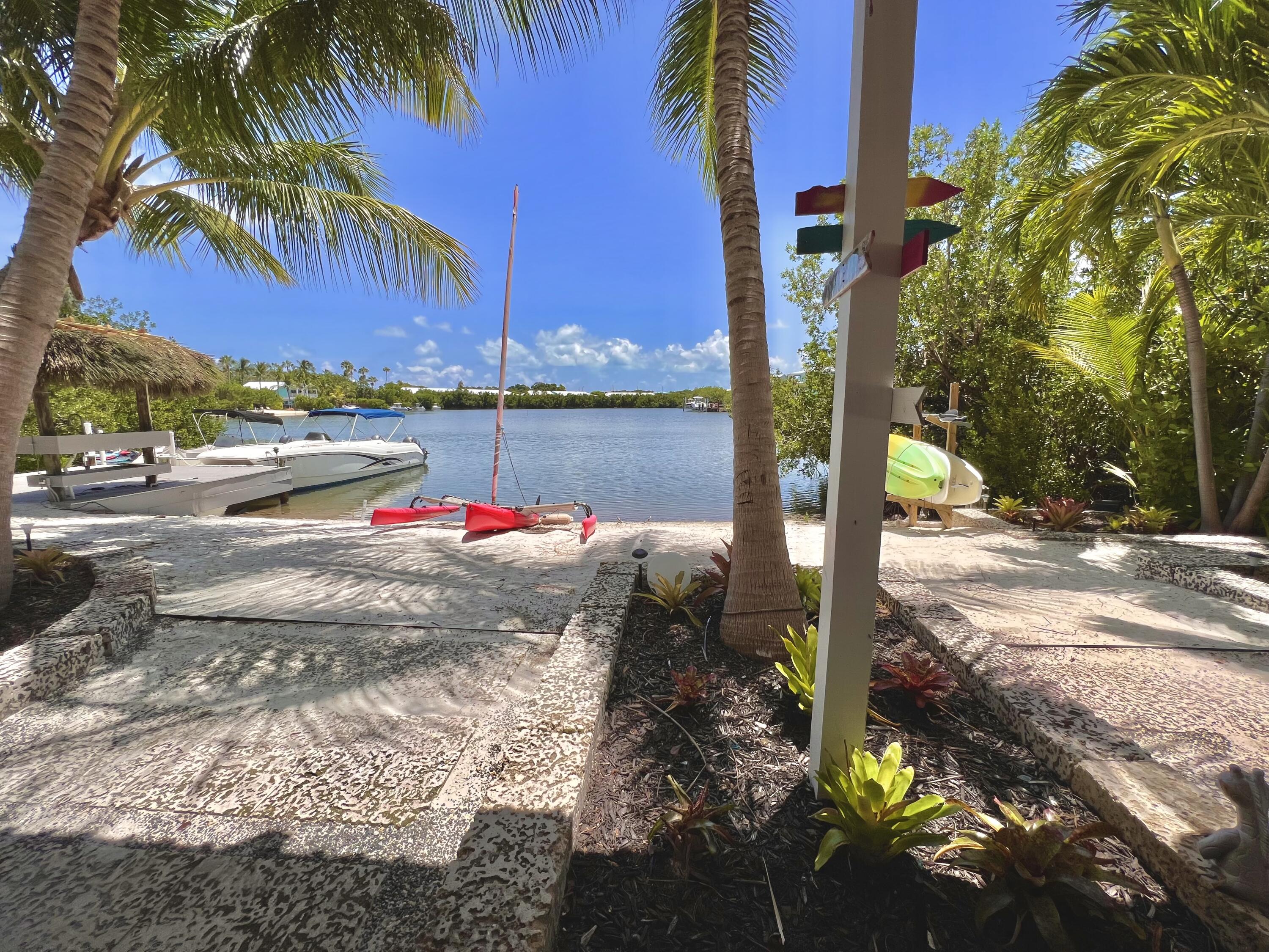 24 Bounty Lane Key Largo, FL 33037 - Photo 30 of 36 a view of a street with palm trees