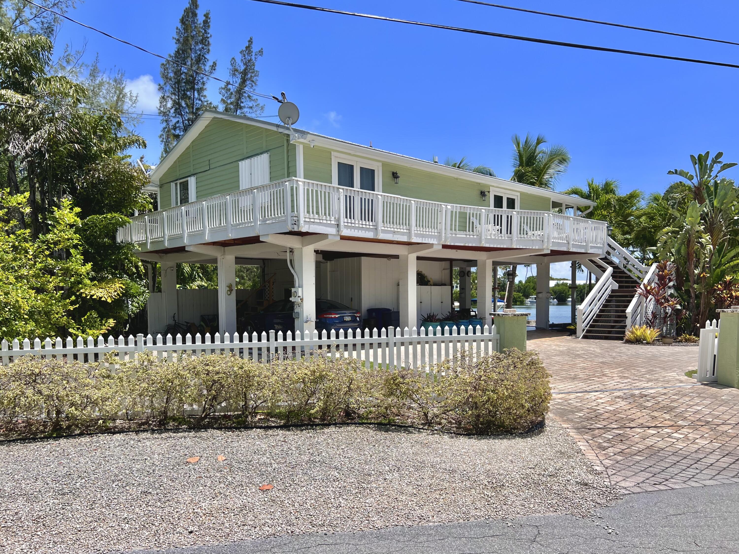 24 Bounty Lane Key Largo, FL 33037 - Photo 33 of 36 a front view of a house with a garden