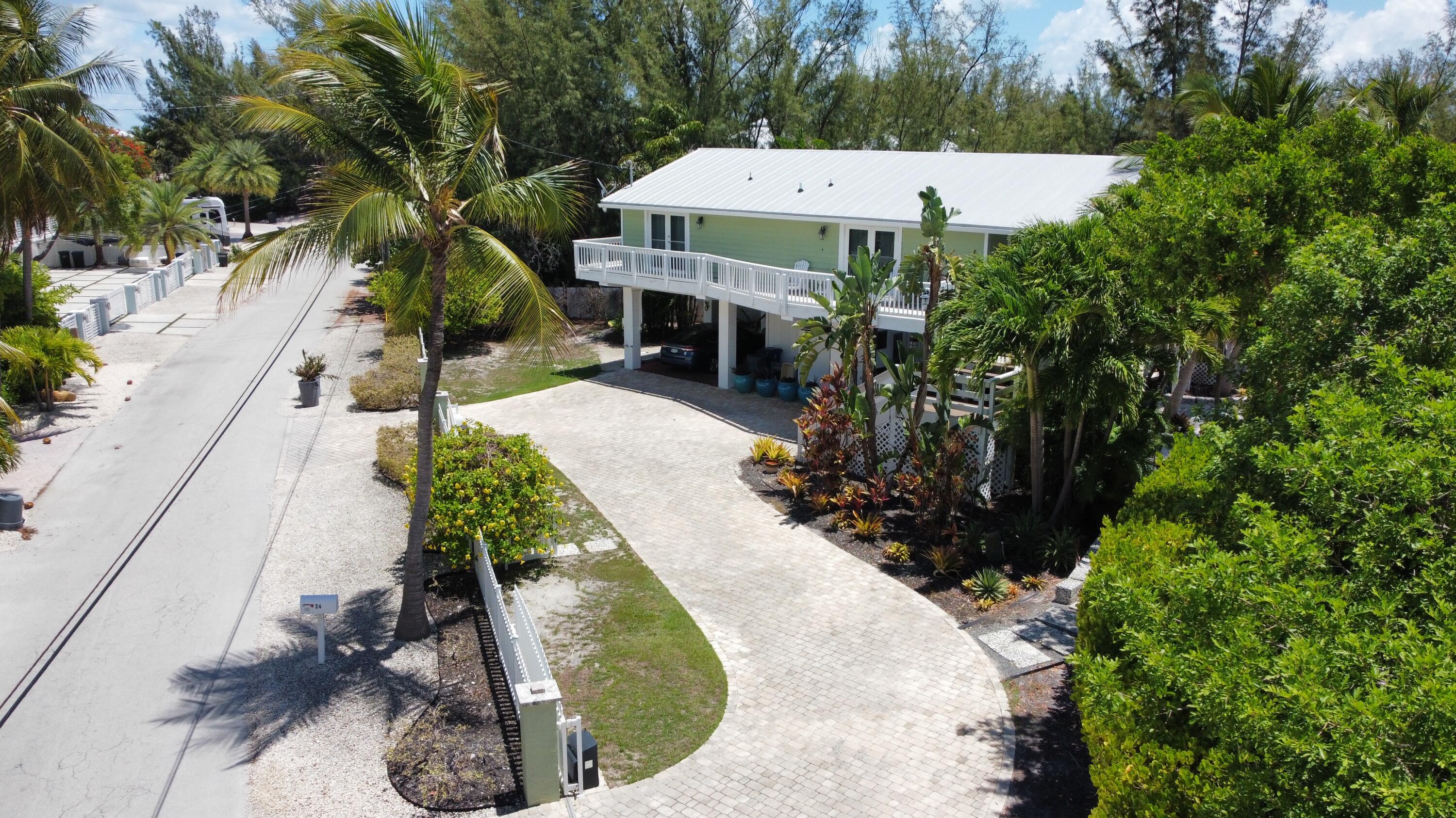 24 Bounty Lane Key Largo, FL 33037 - Photo 5 of 36 a view of a house with a yard and sitting area