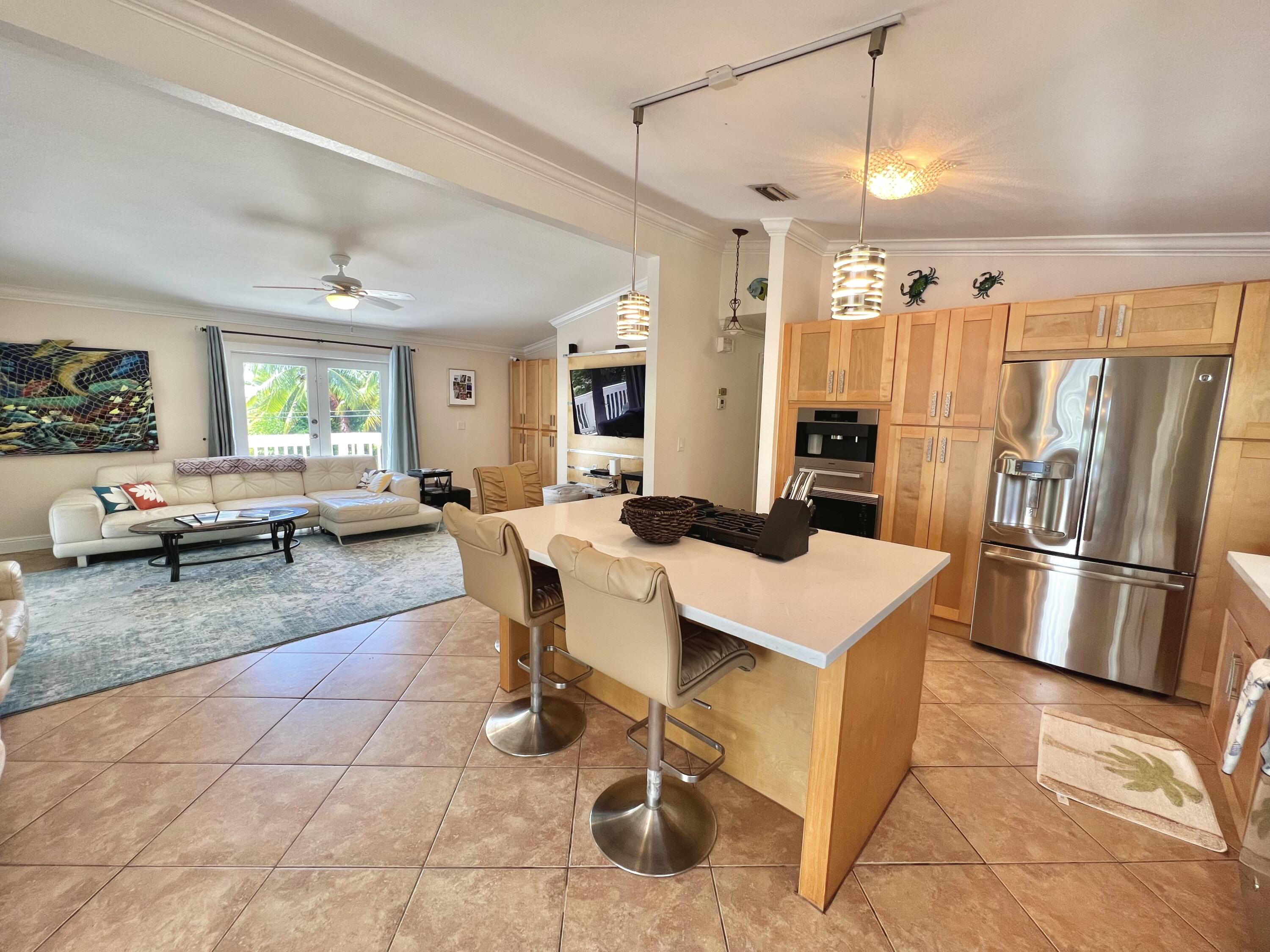 24 Bounty Lane Key Largo, FL 33037 - Photo 7 of 36 a large kitchen with a table and chairs