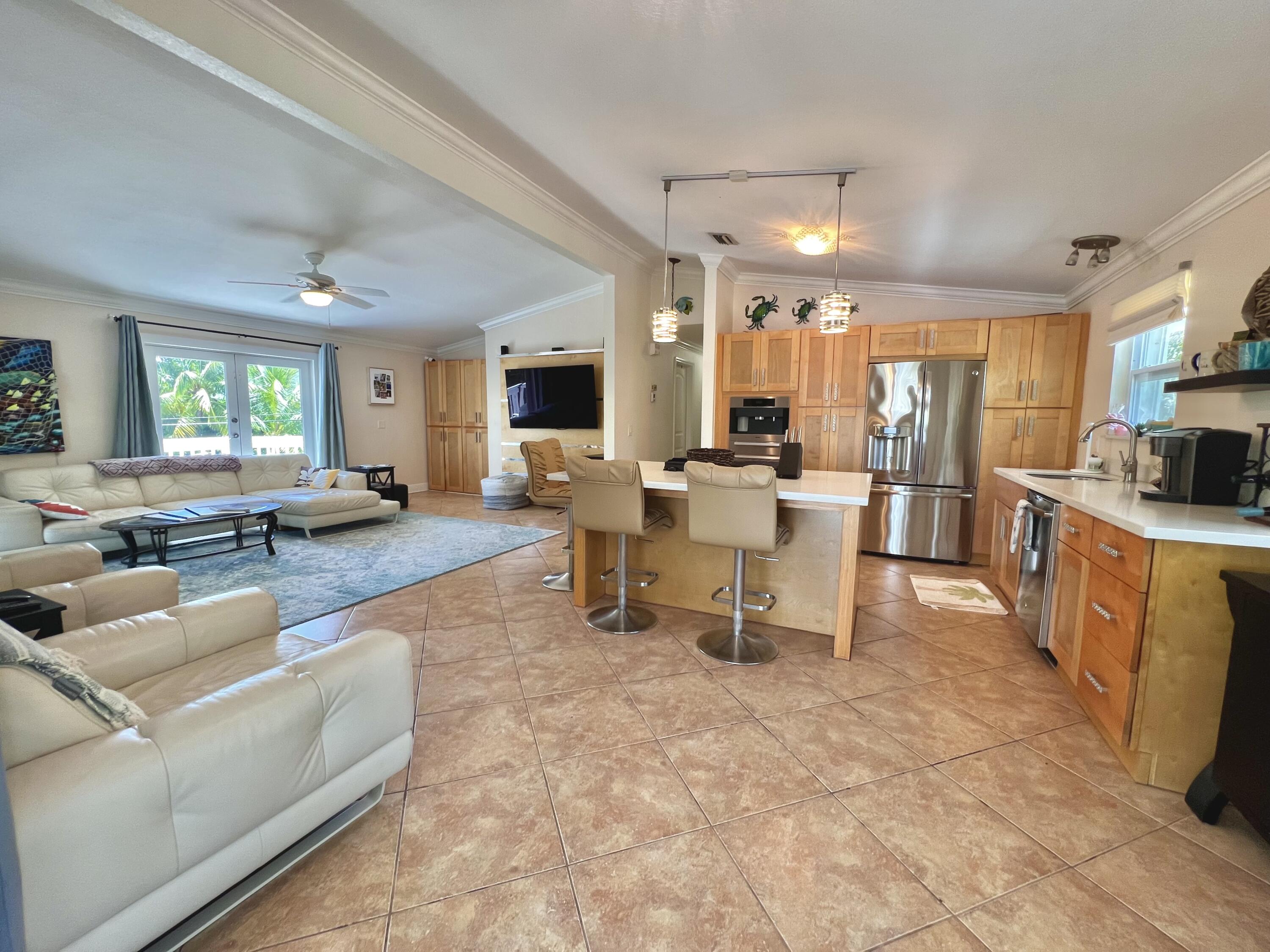 24 Bounty Lane Key Largo, FL 33037 - Photo 36 of 36 a living room with furniture and a flat screen tv