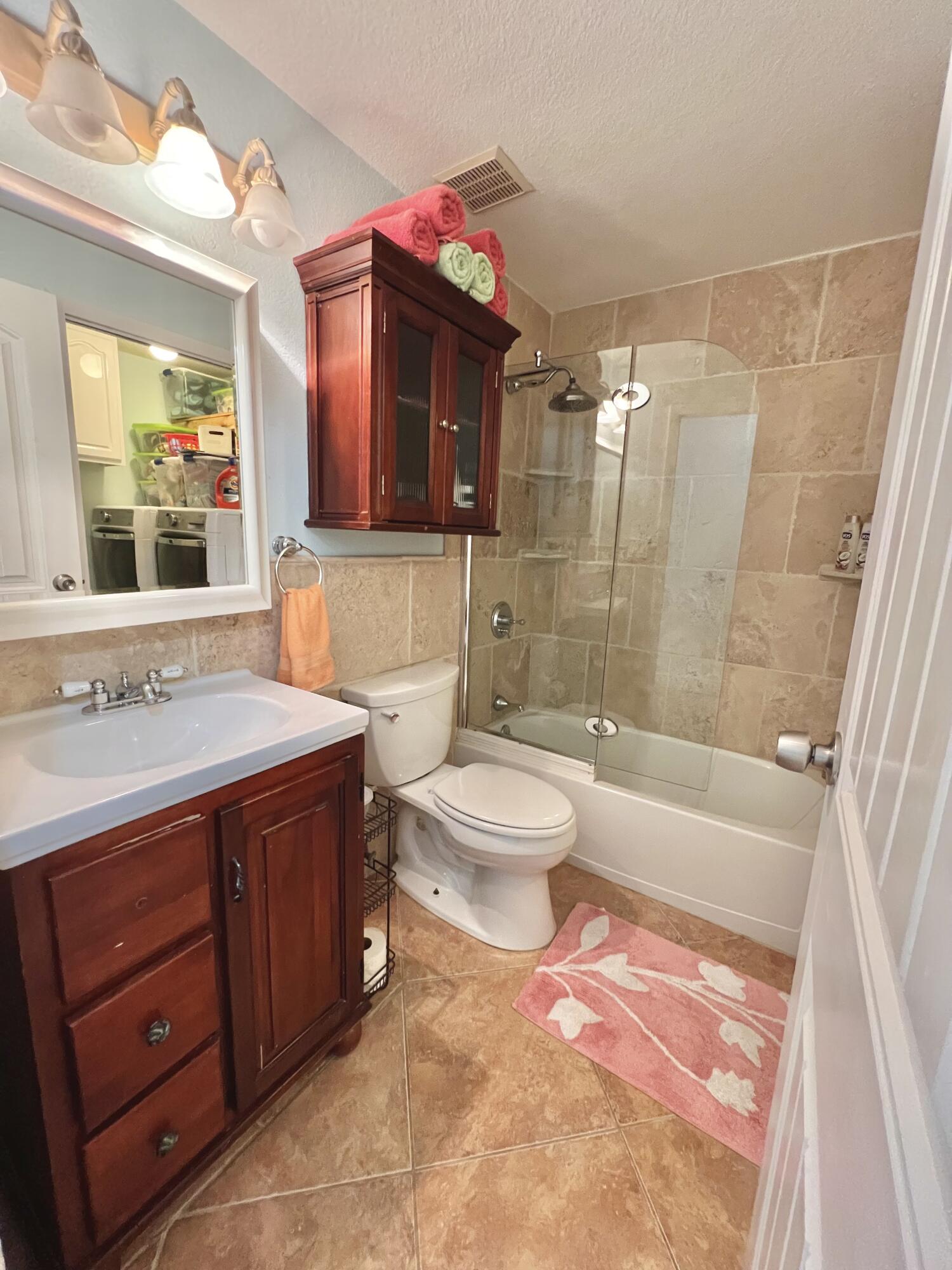 24 Bounty Lane Key Largo, FL 33037 - Photo 9 of 36 a bathroom with a sink a toilet and shower