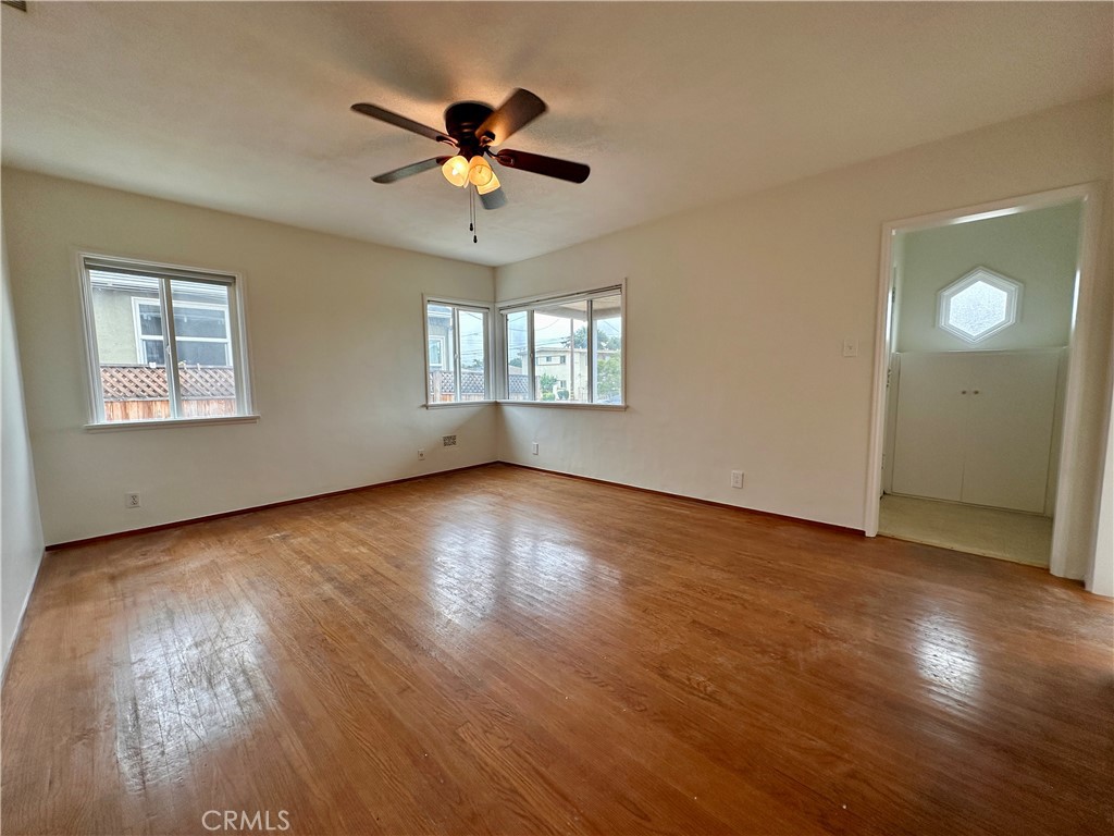 823 Edith Avenue Alhambra, CA 91803 - Photo 3 of 46 a view of an empty room with wooden floor and a window
