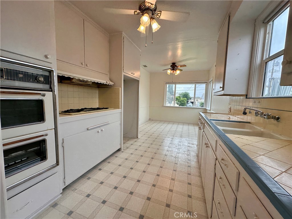 823 Edith Avenue Alhambra, CA 91803 - Photo 34 of 46 a kitchen with stainless steel appliances a stove a sink and a microwave