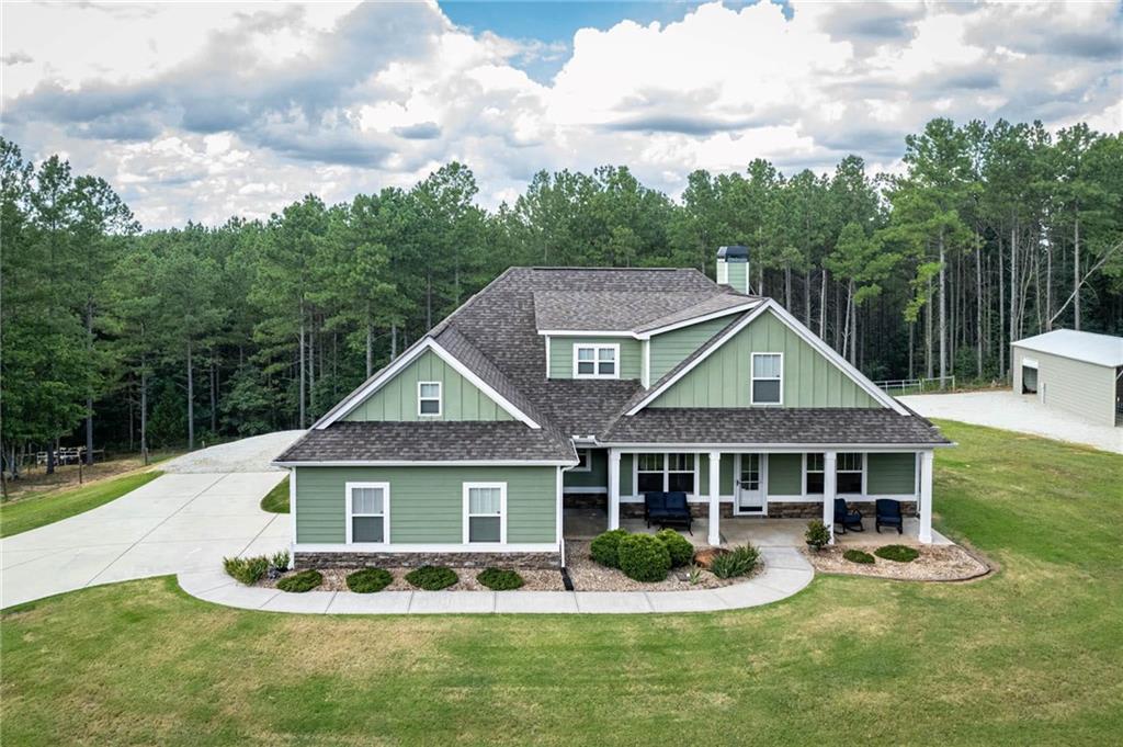 2218 Carson Segars Road Gillsville, GA 30543 - Photo 1 of 1 a front view of a house with garden