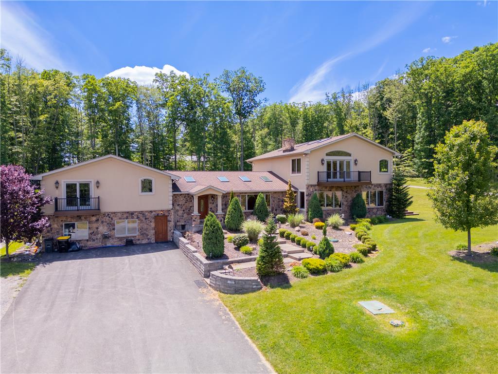 374 Packer Drive Weatherly, PA 18255 - Photo 2 of 30 An inviting stone and stucco facade welcomes you to this woodland retreat with meticulously maintained landscaping.