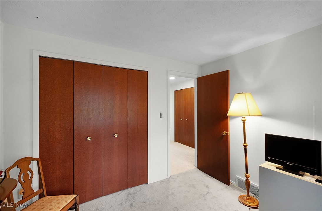 6474 State Road, Unit I10 Parma, OH 44134 - Photo 25 of 31 Bedroom with carpet floors and a closet