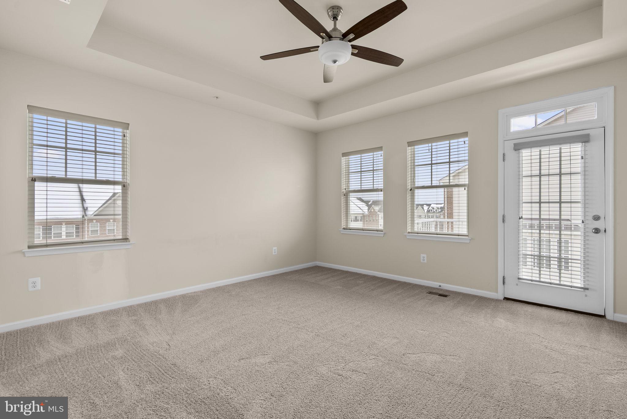 7103 Beaumont Place, Unit A Hanover, MD 21076 - Photo 21 of 53 Primary bedroom w/atrium door to 2nd deck