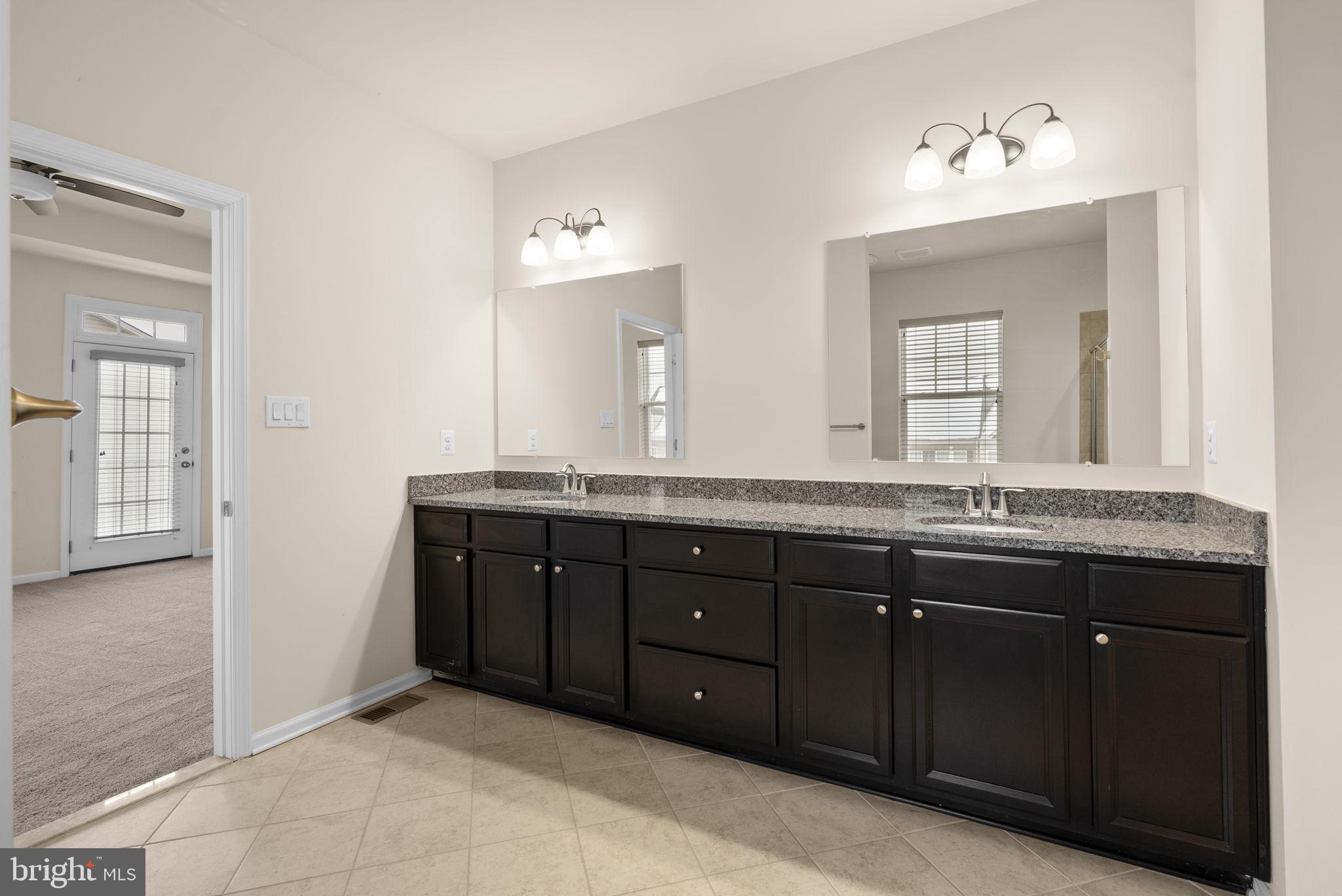 7103 Beaumont Place, Unit A Hanover, MD 21076 - Photo 25 of 53 Primary bathroom w/granite double sink vanity