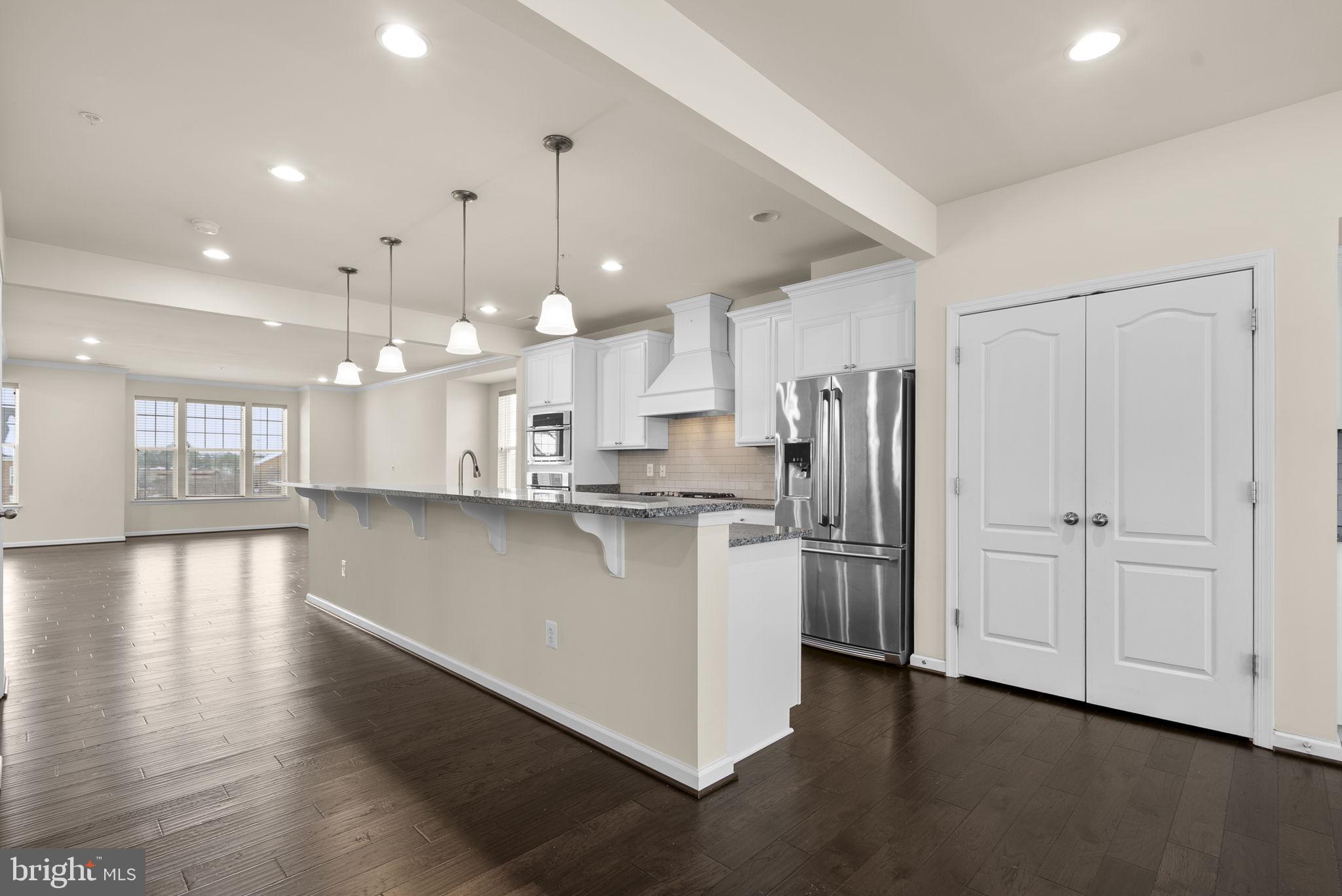 7103 Beaumont Place, Unit A Hanover, MD 21076 - Photo 9 of 53 Gas cooktop and subway tile backsplash