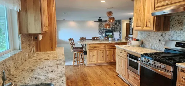 a kitchen with a cabinets and a stove