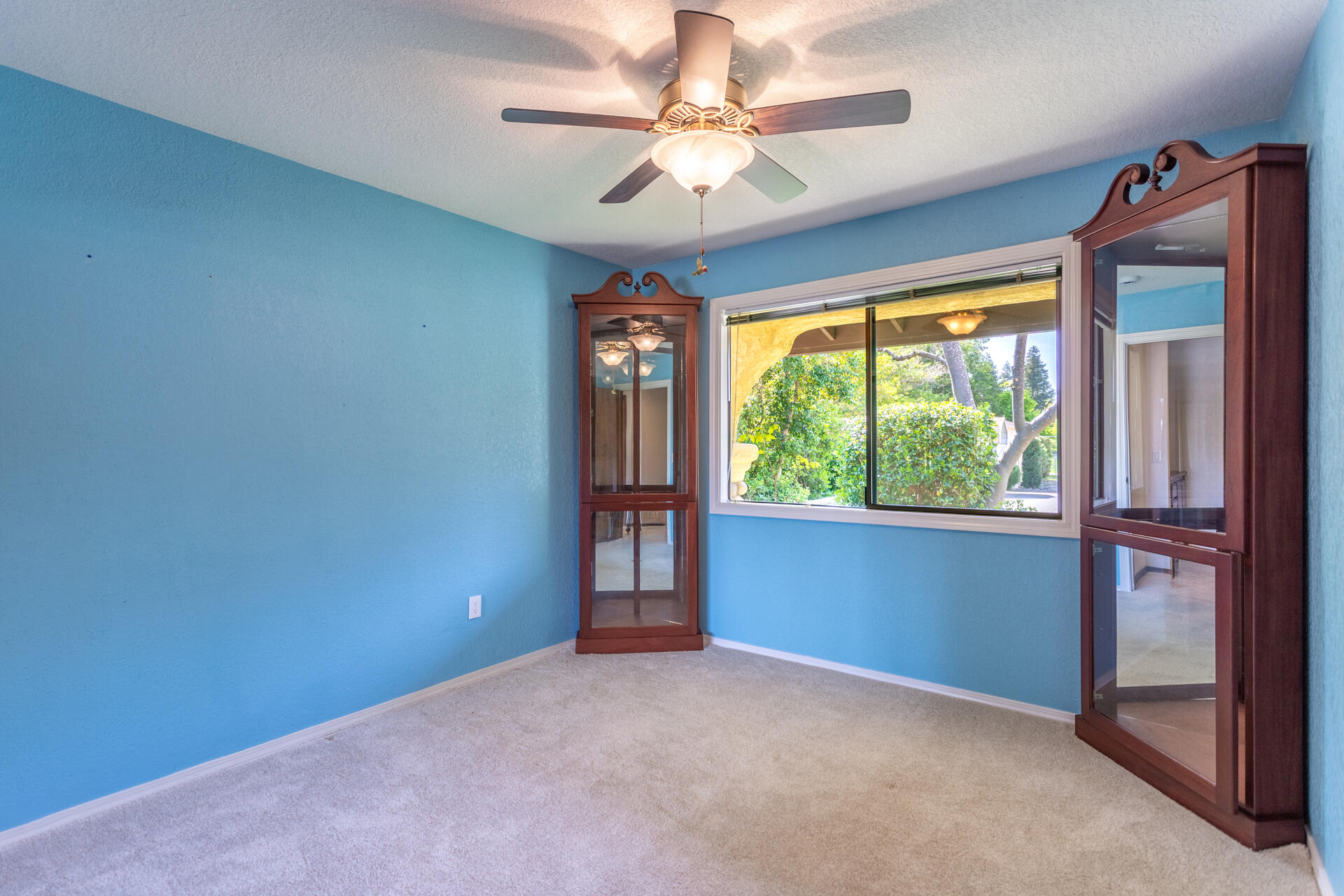 22425 Brent Road Red Bluff, CA 96080 - Photo 28 of 62 an empty room with windows and fan