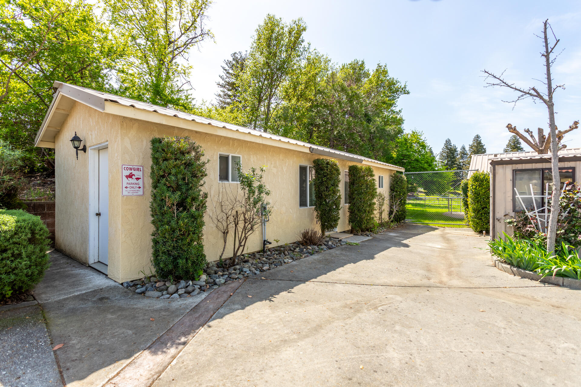 22425 Brent Road Red Bluff, CA 96080 - Photo 30 of 62 a front view of a house with garden