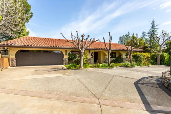 a front view of a house with yard