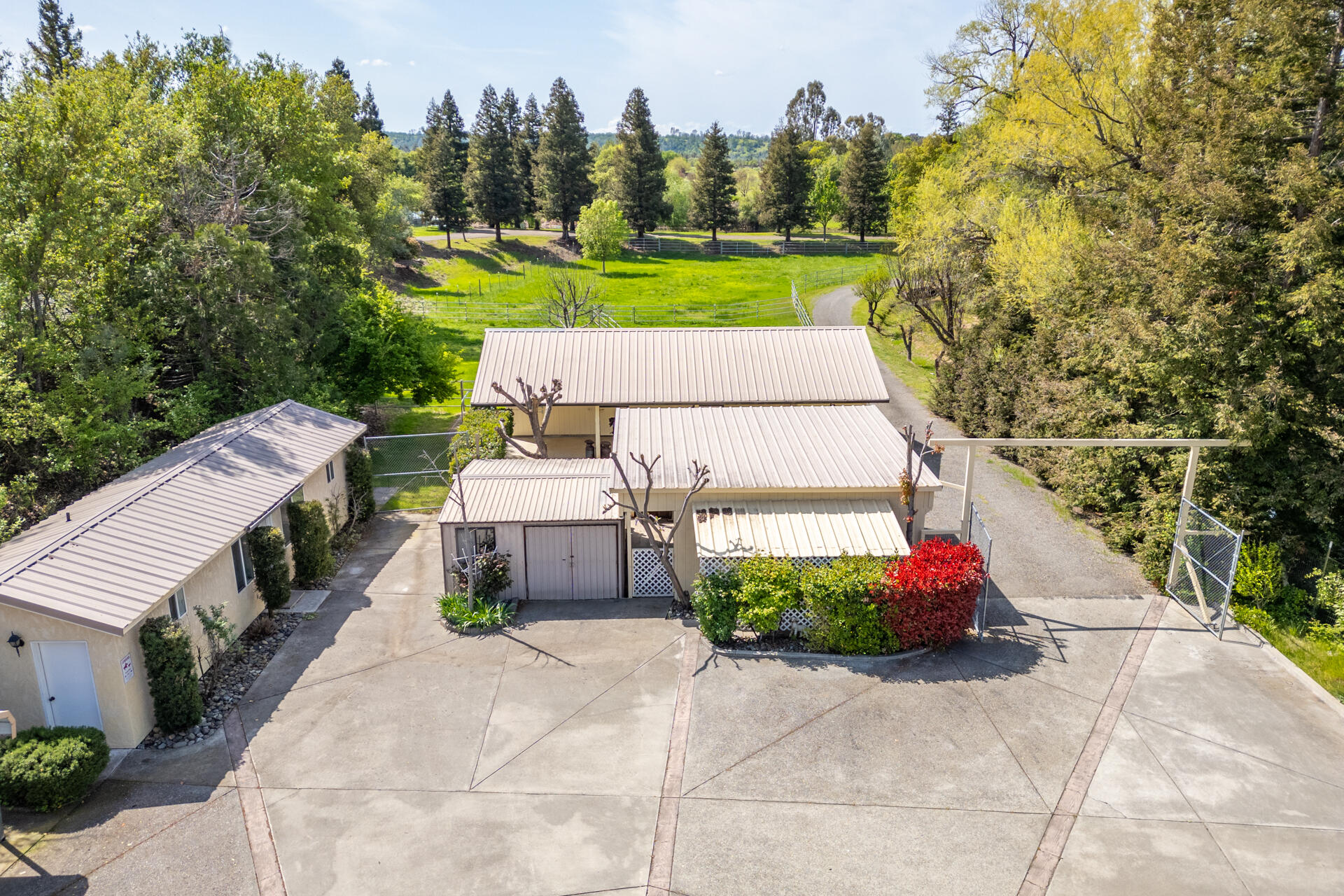 22425 Brent Road Red Bluff, CA 96080 - Photo 4 of 62 a view of a patio with table and chairs and potted plants