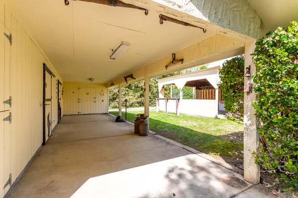 a view of a swimming pool with an outdoor space and seating area