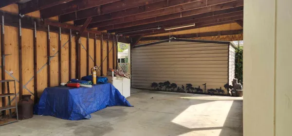 a view of yard with swimming pool and green space