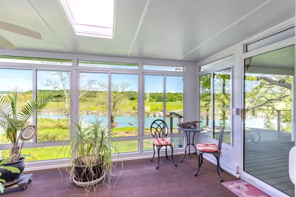 a view of a couches in the balcony