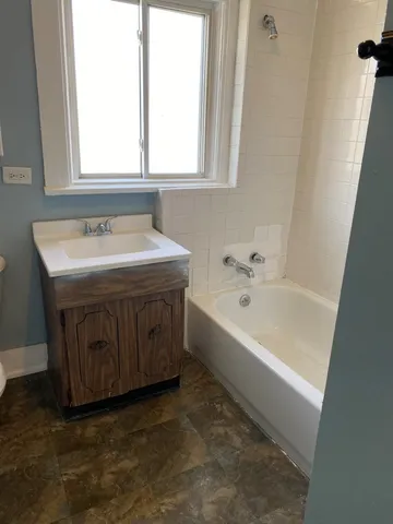 a bathroom with a sink and a bathtub