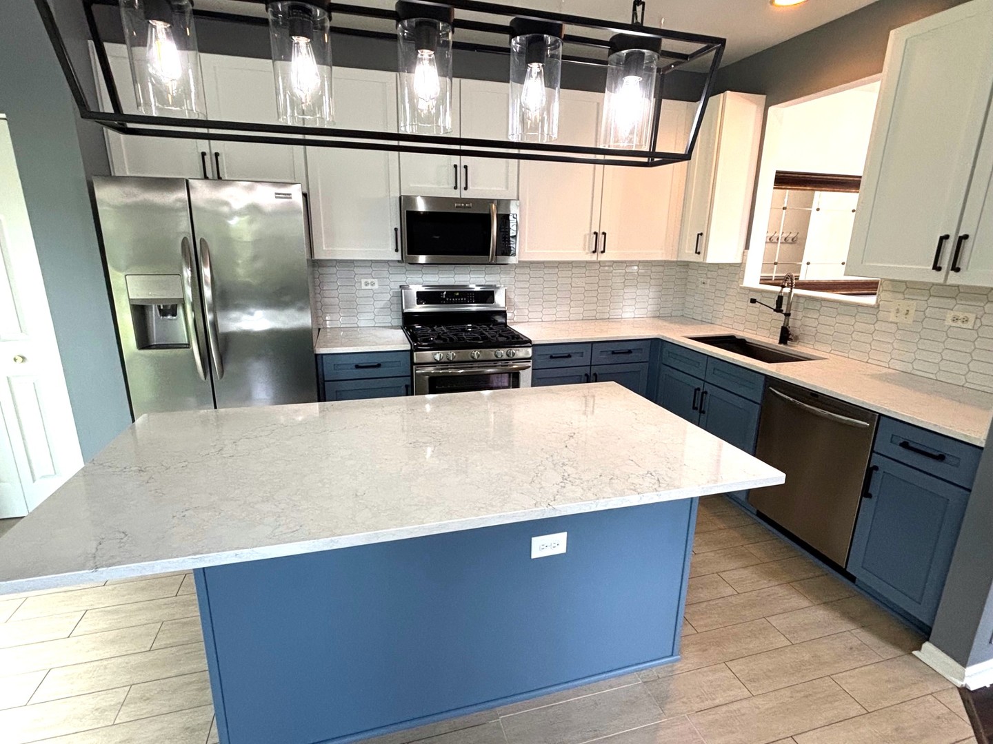 2468 Reflections Drive Aurora, IL 60502 - Photo 11 of 44 a kitchen with stainless steel appliances a sink stove and refrigerator
