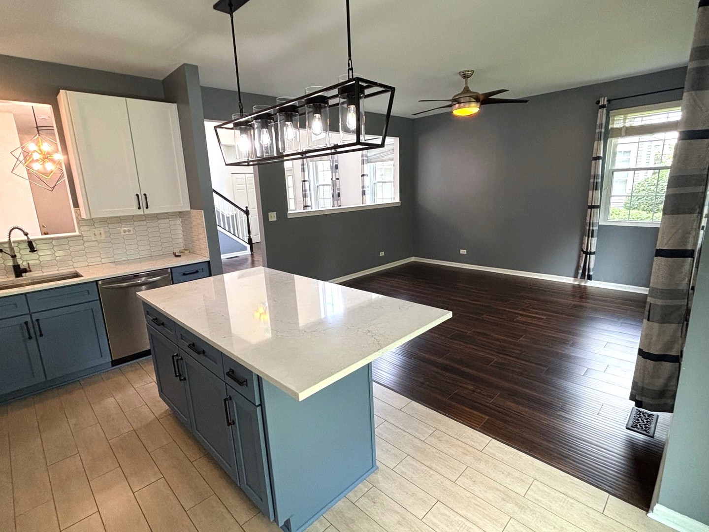 2468 Reflections Drive Aurora, IL 60502 - Photo 13 of 44 a kitchen with stainless steel appliances granite countertop a sink a stove and a wooden floors
