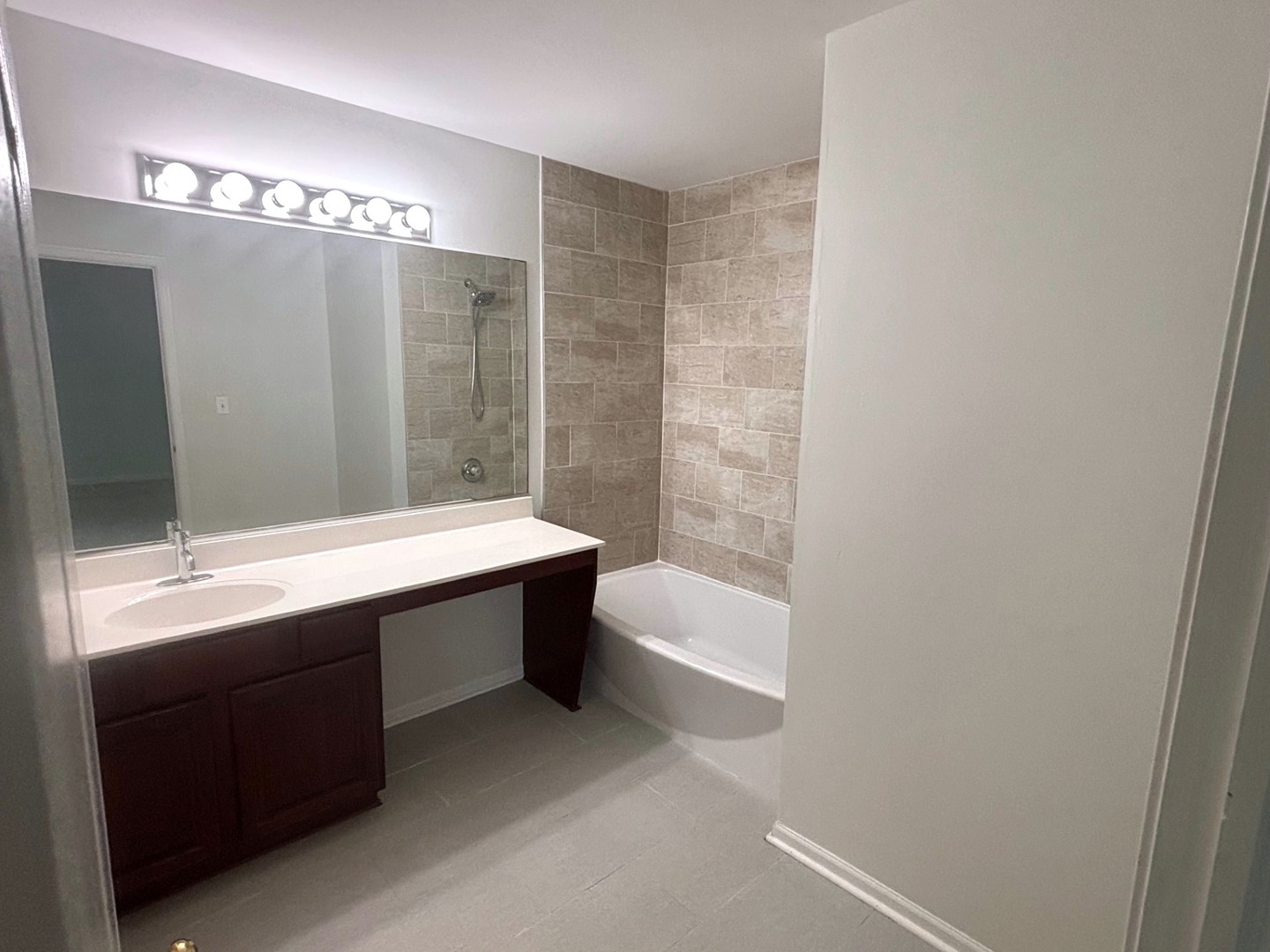 2468 Reflections Drive Aurora, IL 60502 - Photo 27 of 44 a bathroom with a bathtub and a sink