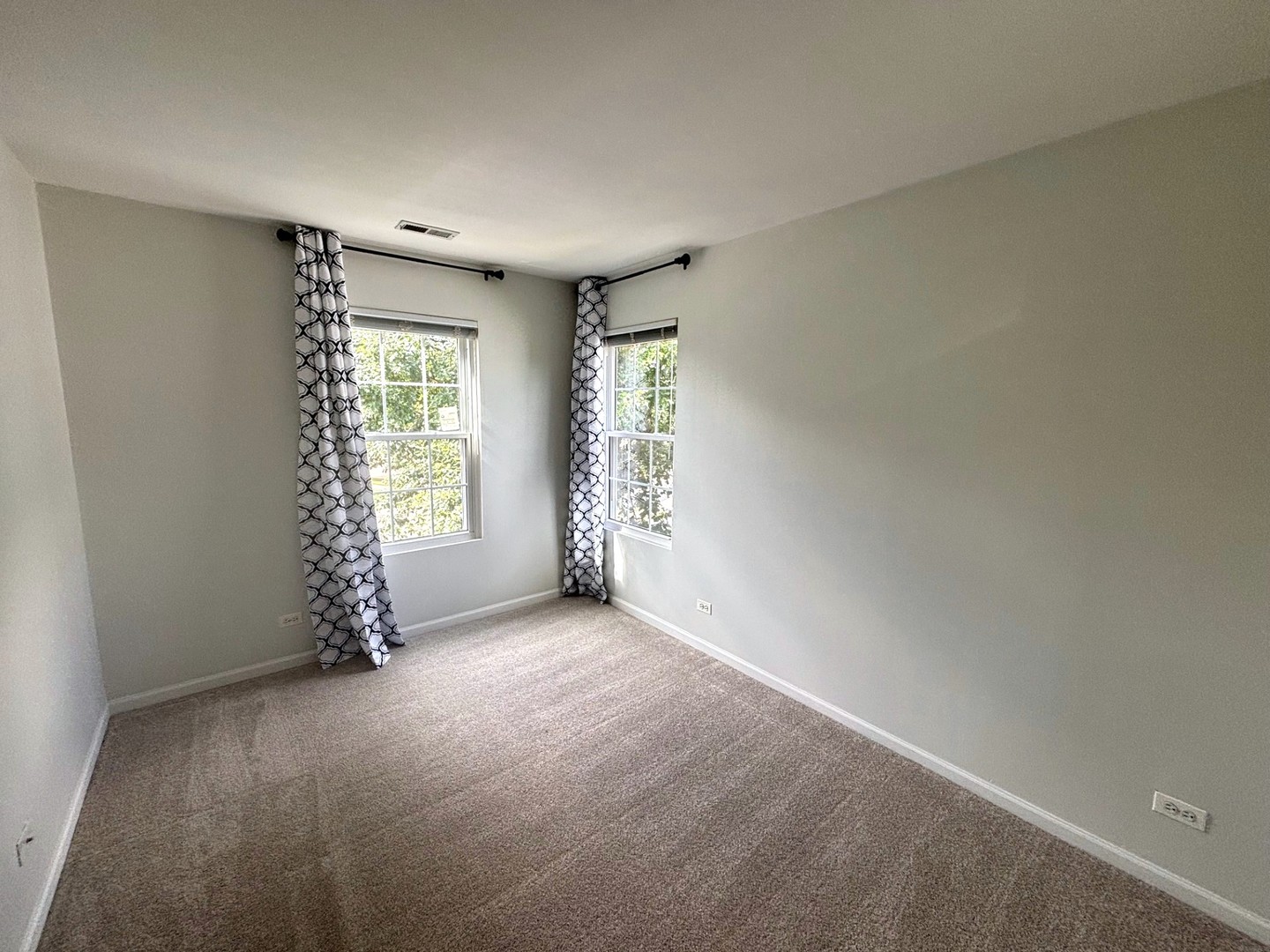 2468 Reflections Drive Aurora, IL 60502 - Photo 30 of 44 an empty room with windows and closet