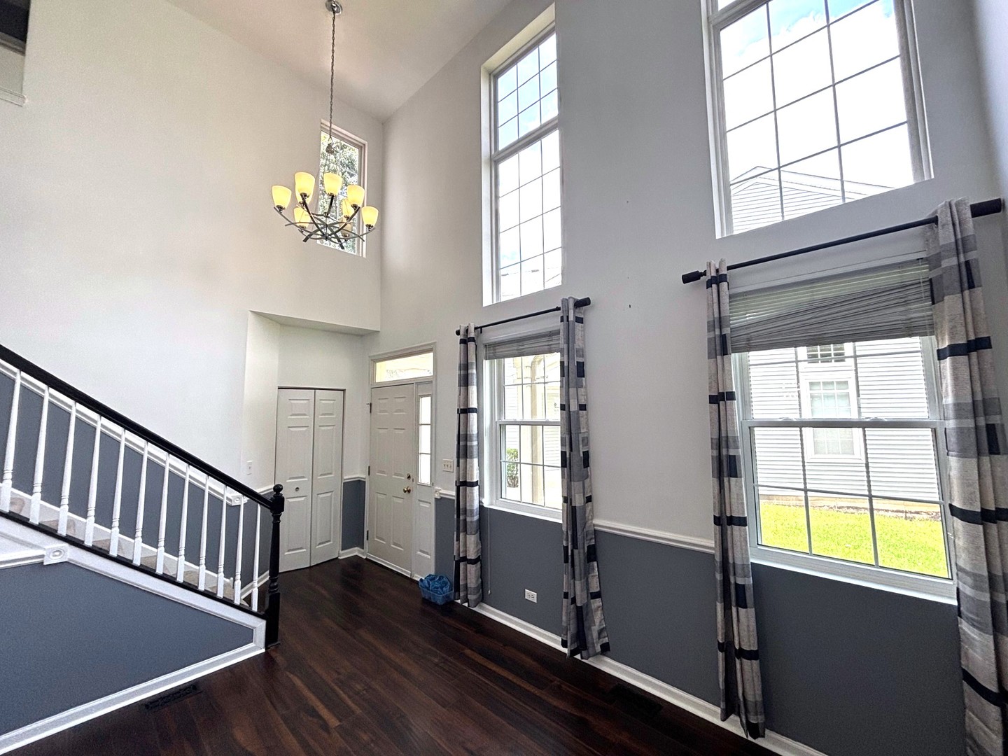 2468 Reflections Drive Aurora, IL 60502 - Photo 3 of 44 a view of an empty room with wooden floor and a window