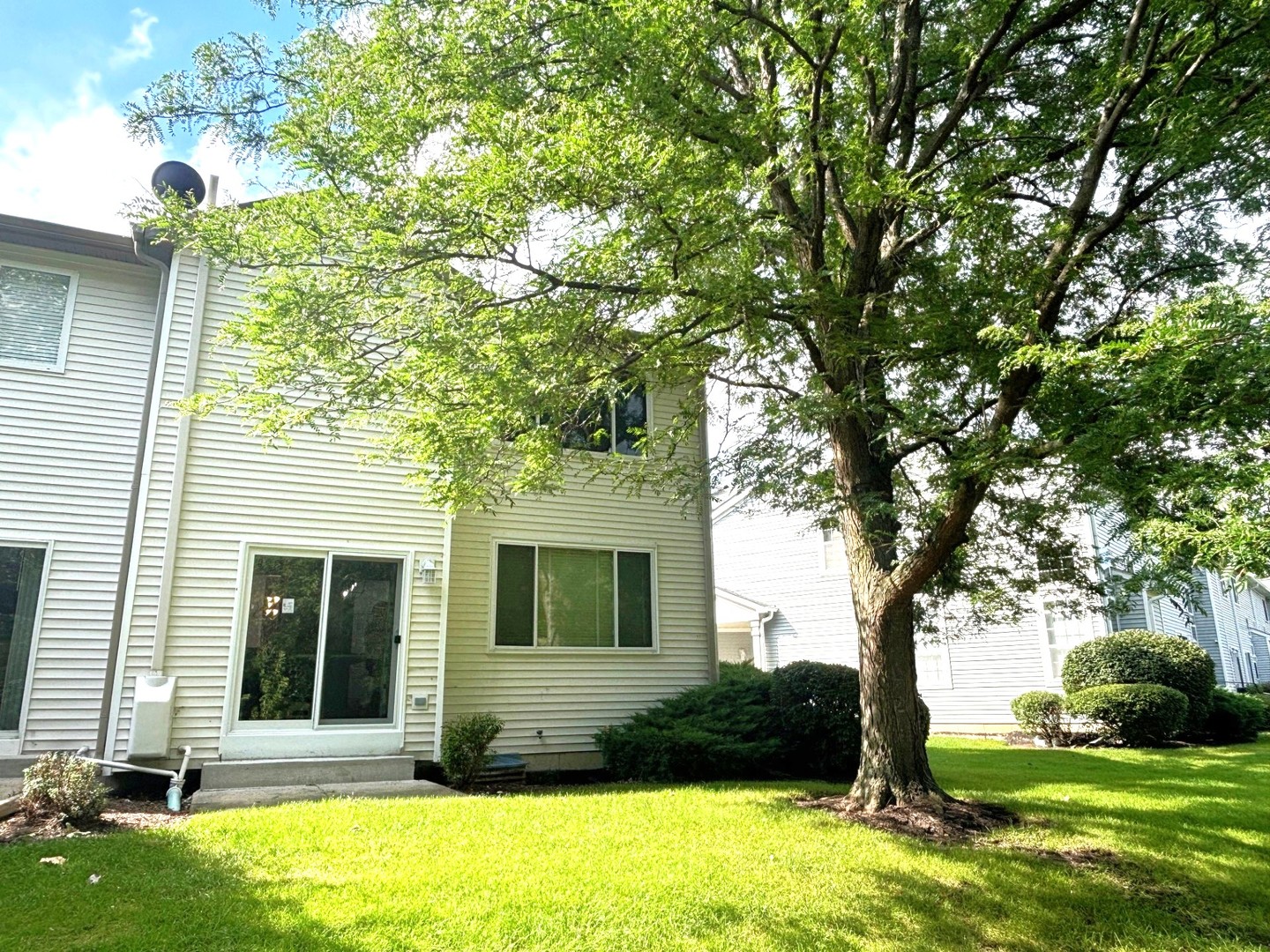 2468 Reflections Drive Aurora, IL 60502 - Photo 40 of 44 a front view of a house with yard and green space