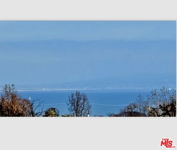 a view of ocean with sunset