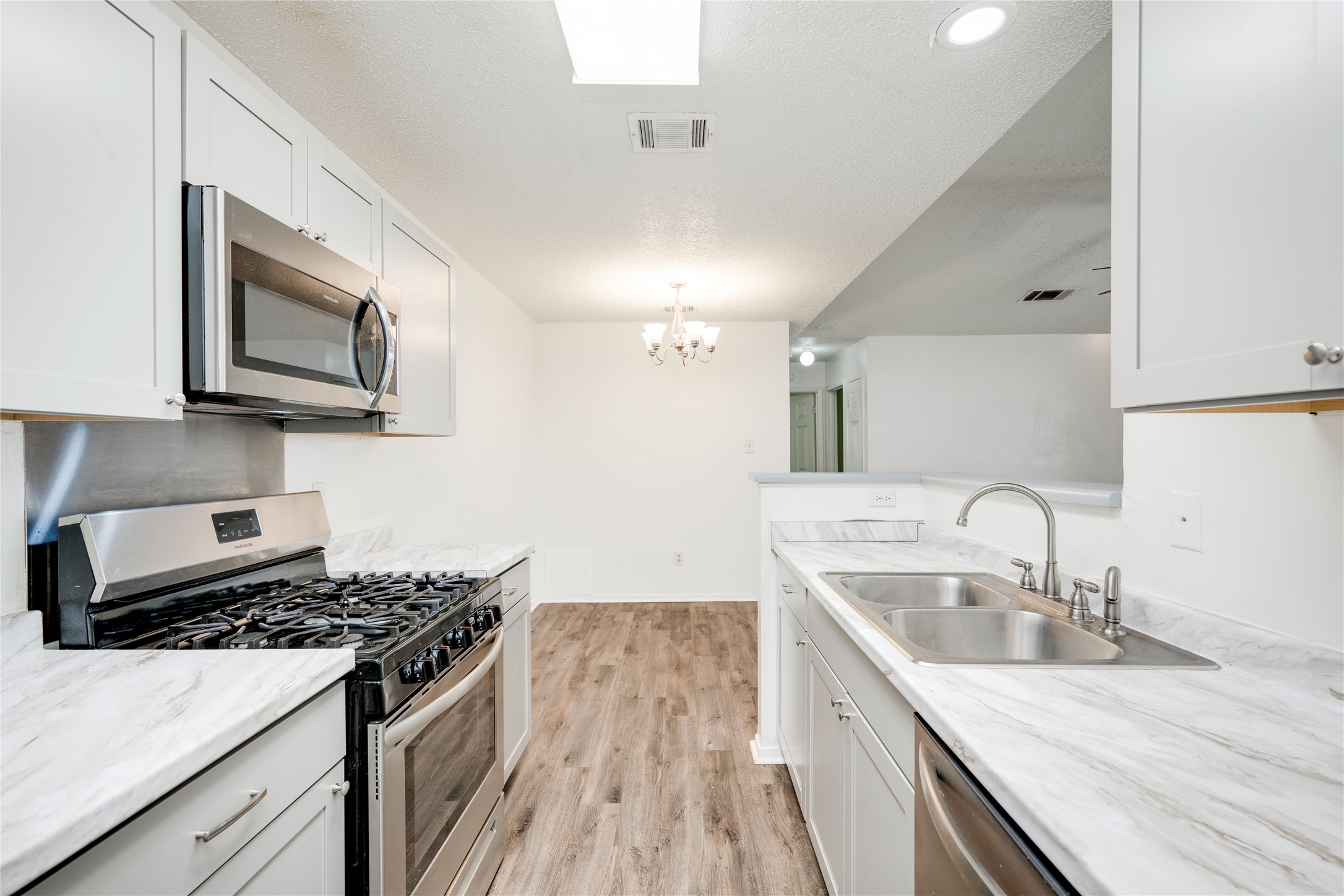7918 West Gate Boulevard Austin, TX 78745 - Photo 22 of 31 A well-equipped kitchen showcasing modern appliances and bright finishes for effortless meal preparation.