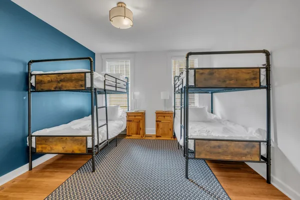 a bedroom with furniture and a window