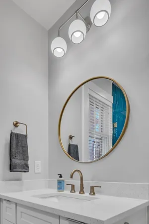 a bathroom with a sink and mirror