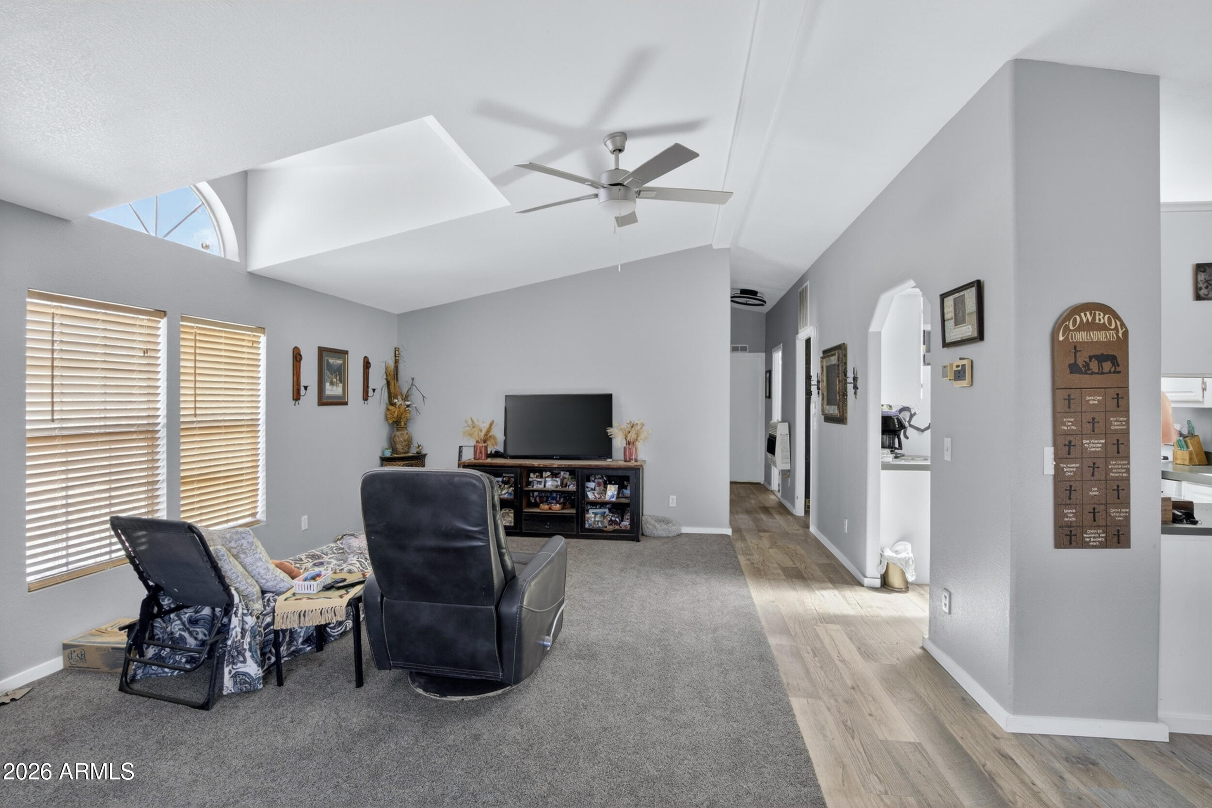 38809 East Spotted Horse Road Florence, AZ 85132 - Photo 12 of 40 a living room with furniture and a flat screen tv