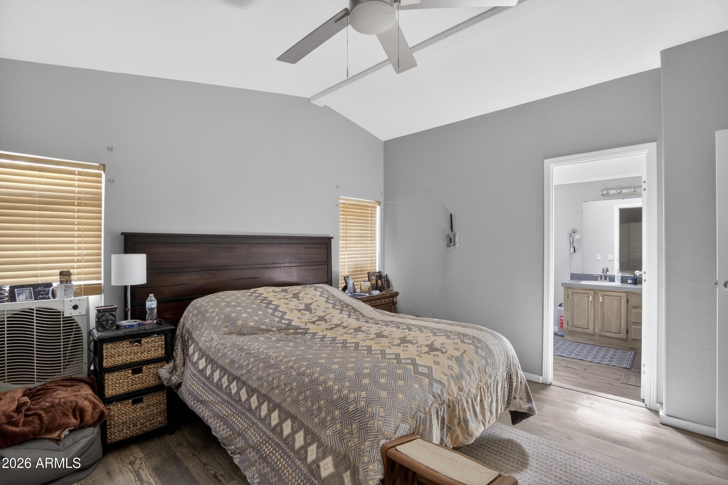 38809 East Spotted Horse Road Florence, AZ 85132 - Photo 14 of 40 a bedroom with a bed and wooden floor