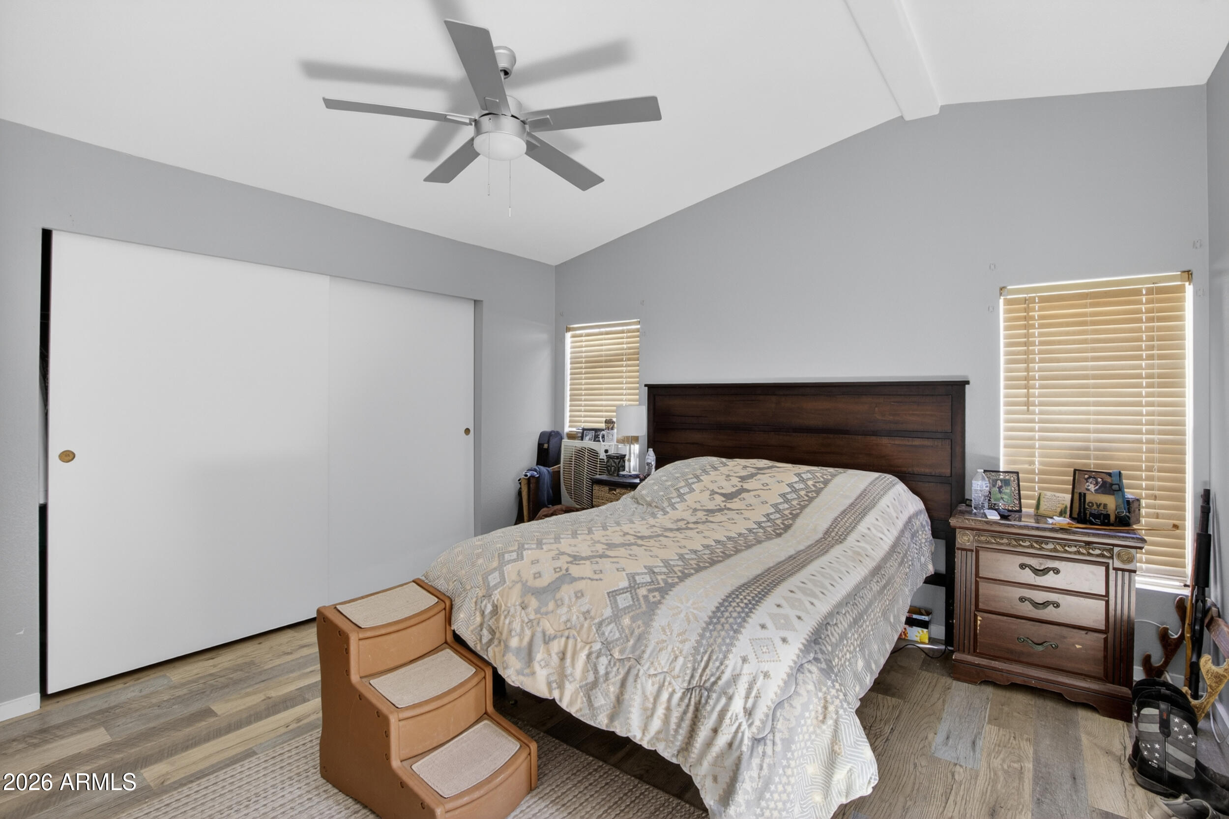 38809 East Spotted Horse Road Florence, AZ 85132 - Photo 15 of 40 a bedroom with a bed and a table in it