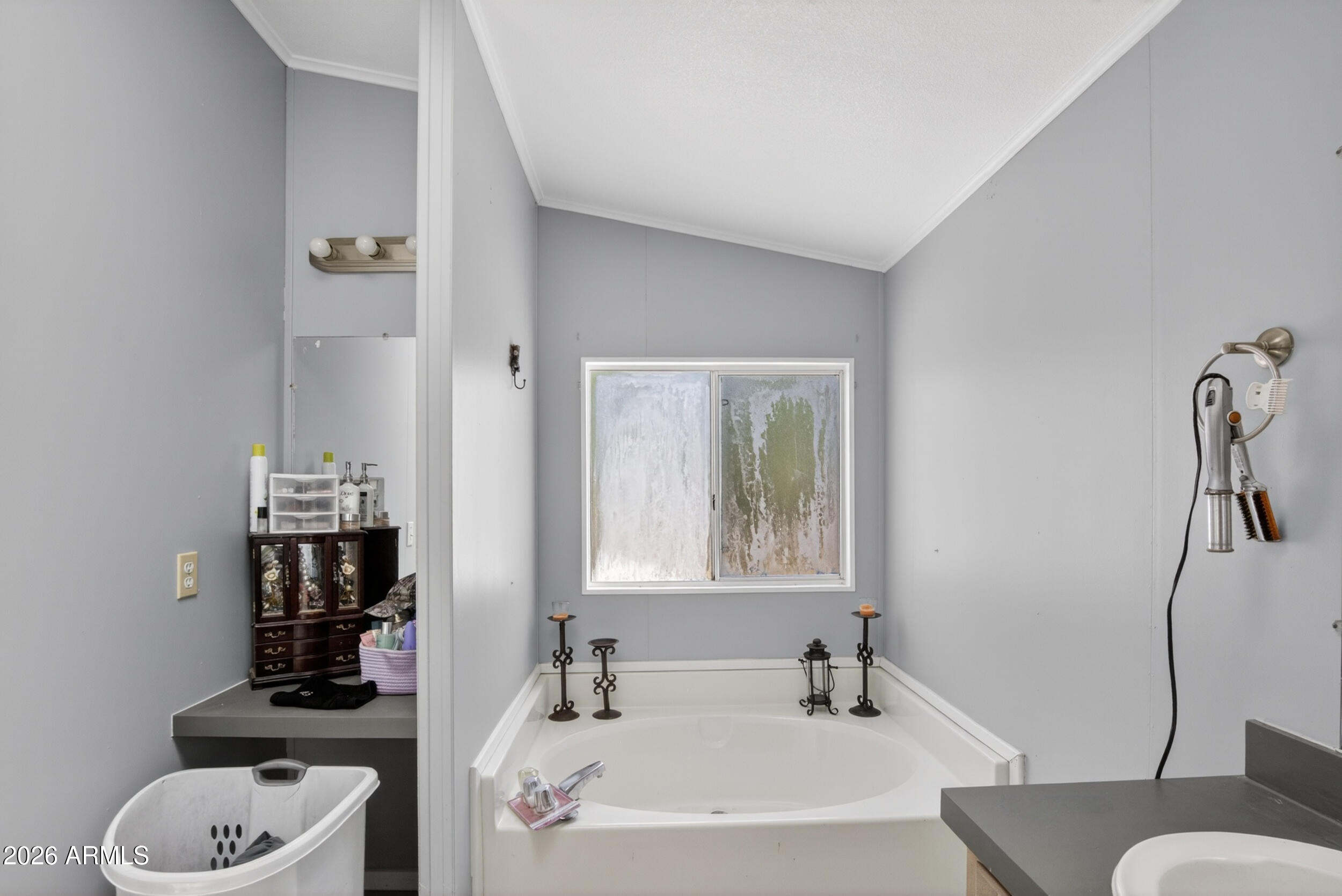 38809 East Spotted Horse Road Florence, AZ 85132 - Photo 17 of 40 a bathroom with a sink a toilet and a mirror