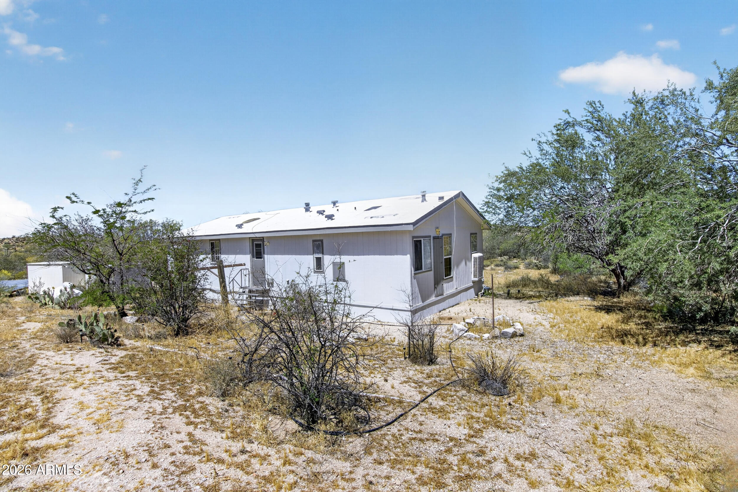 38809 East Spotted Horse Road Florence, AZ 85132 - Photo 24 of 40 a view of a house with a yard and plants