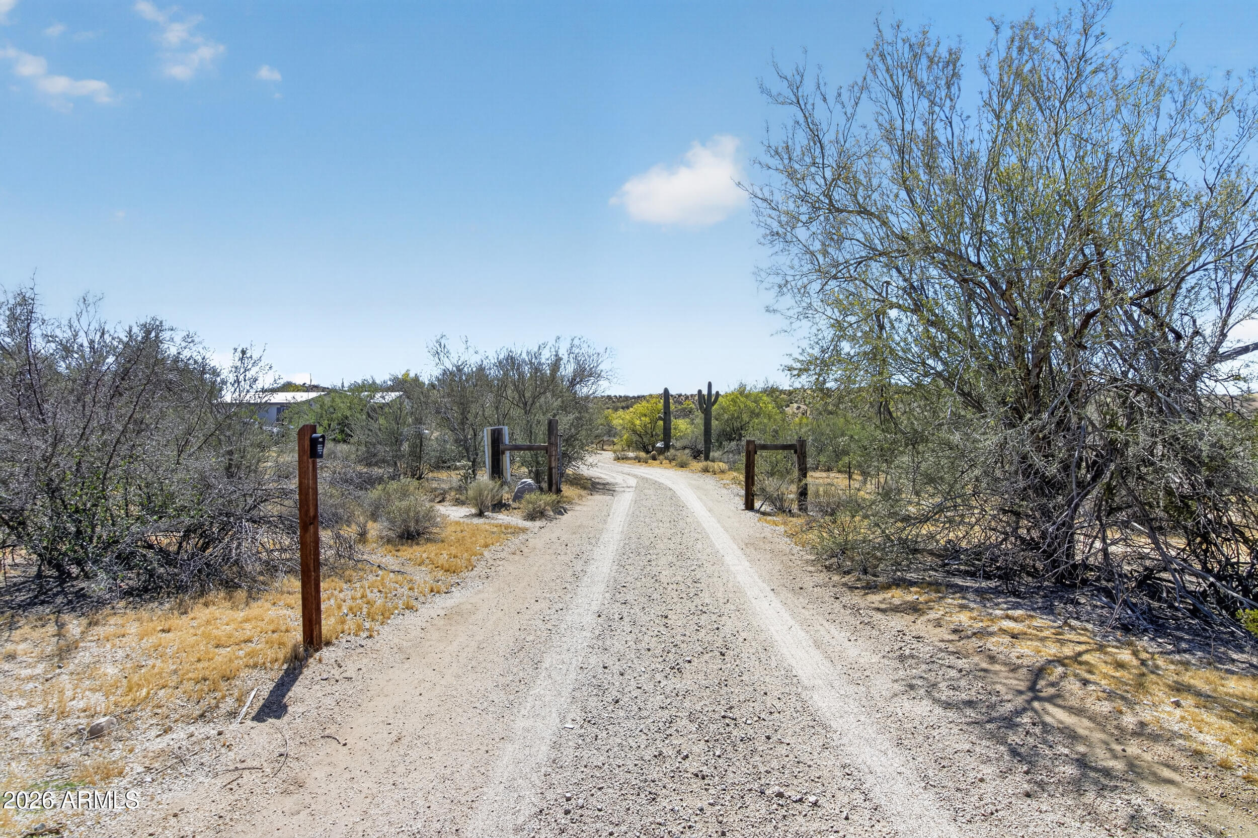 38809 East Spotted Horse Road Florence, AZ 85132 - Photo 32 of 40 a view of a road with a wrought fence