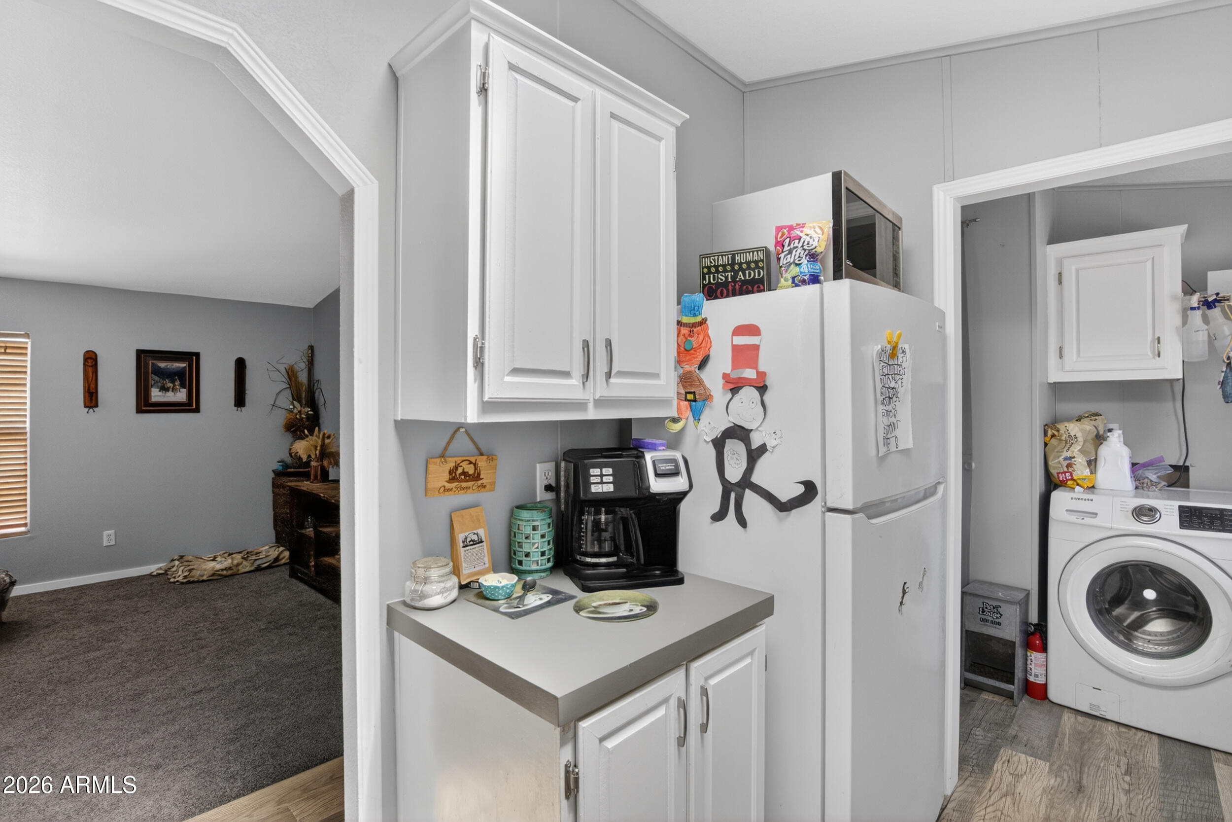 38809 East Spotted Horse Road Florence, AZ 85132 - Photo 5 of 40 a room with microwave and refrigerator