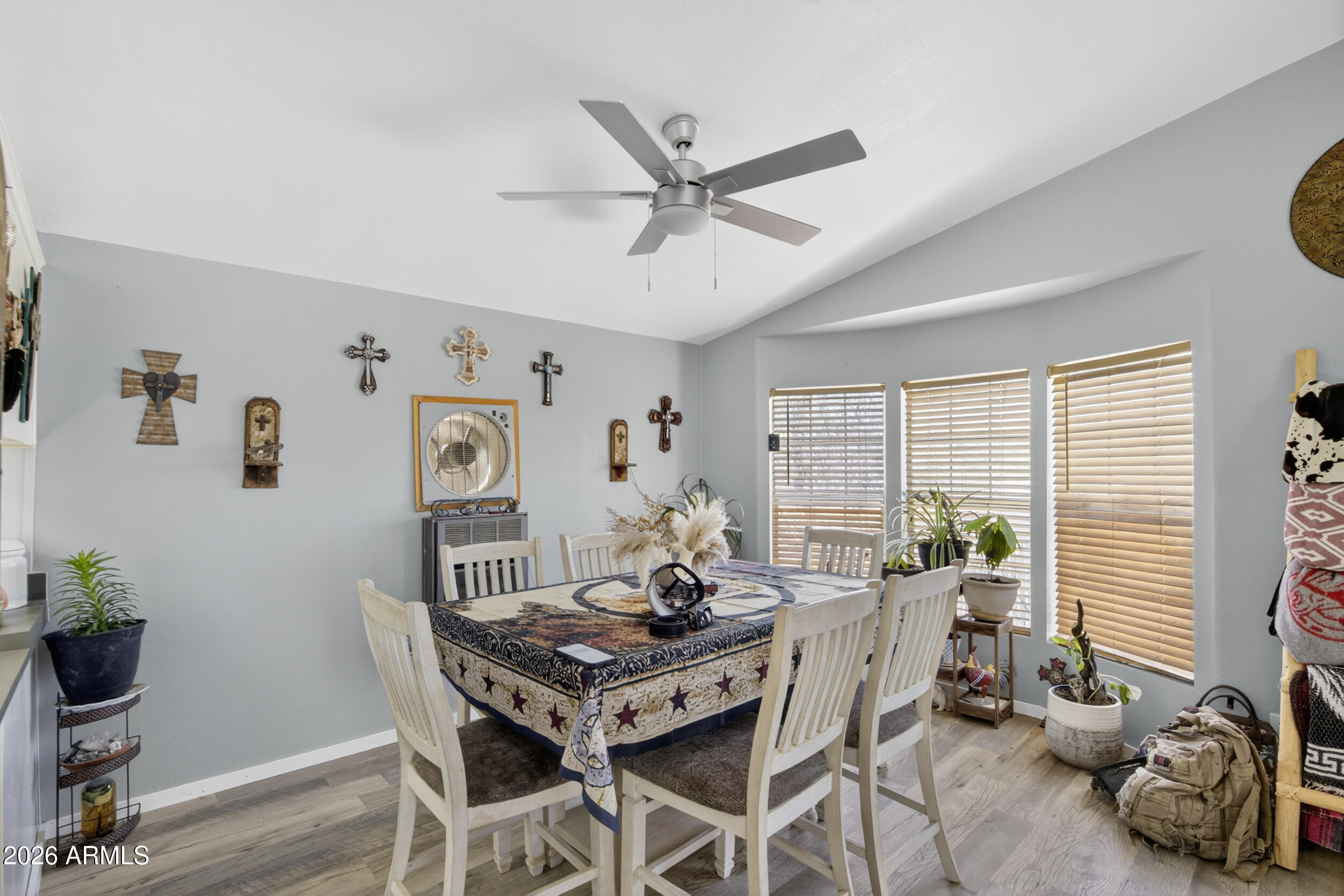 38809 East Spotted Horse Road Florence, AZ 85132 - Photo 9 of 40 a view of a dining room with furniture and a large window
